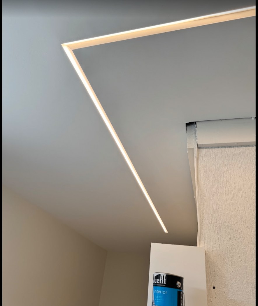 Recessed LED strip lighting set into a plasterboard ceiling